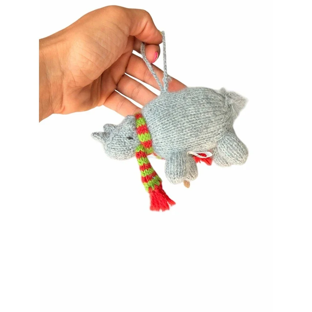 New Mélange Collection hand-knitted rhino ornament, featuring a cozy scarf